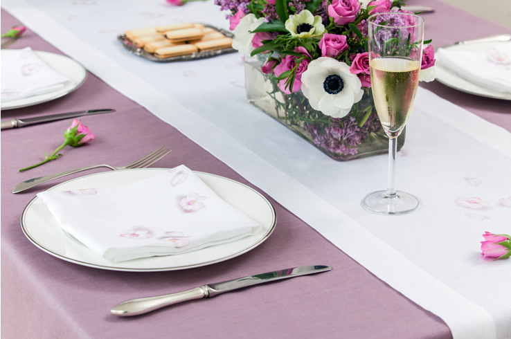 Bridal shower with heather purple lavender tablecloth and cherry blossom linen napkins and table runner by Huddleson with white anemones and pink roses...and, of course, champagne
