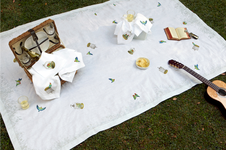 Lovebirds linen tablecloth and napkins by Huddleson with whicker picnic hamper