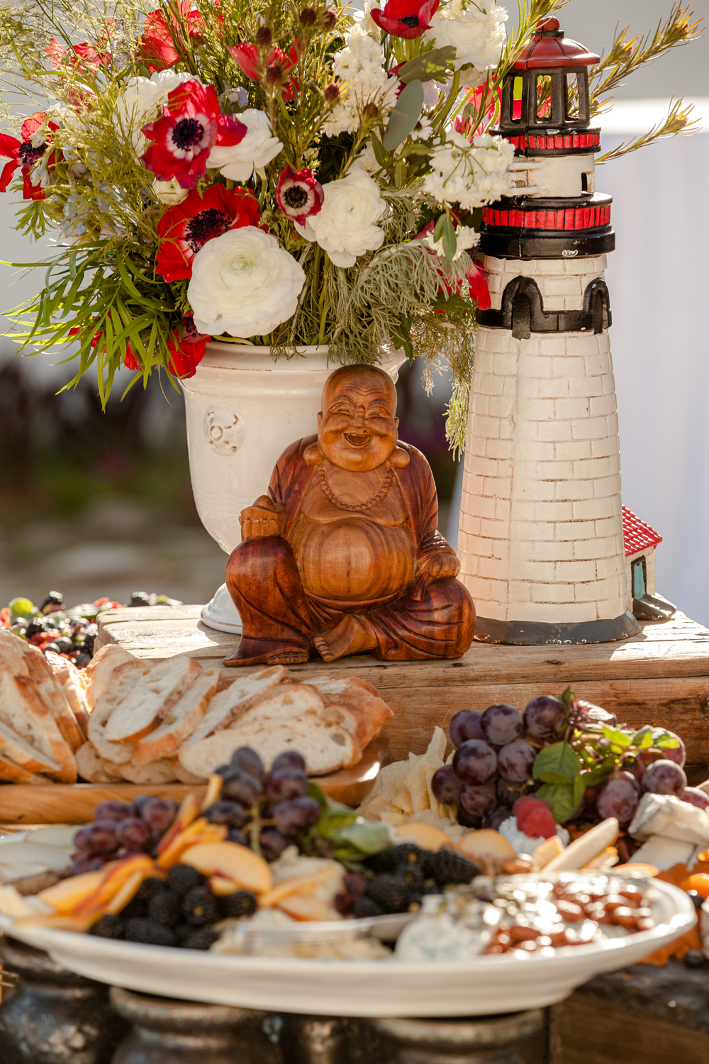 Grazing Table Wedding Cheese Fruit Grapes Centerpiece Buddha Lighthouse Red White Florals Anemone