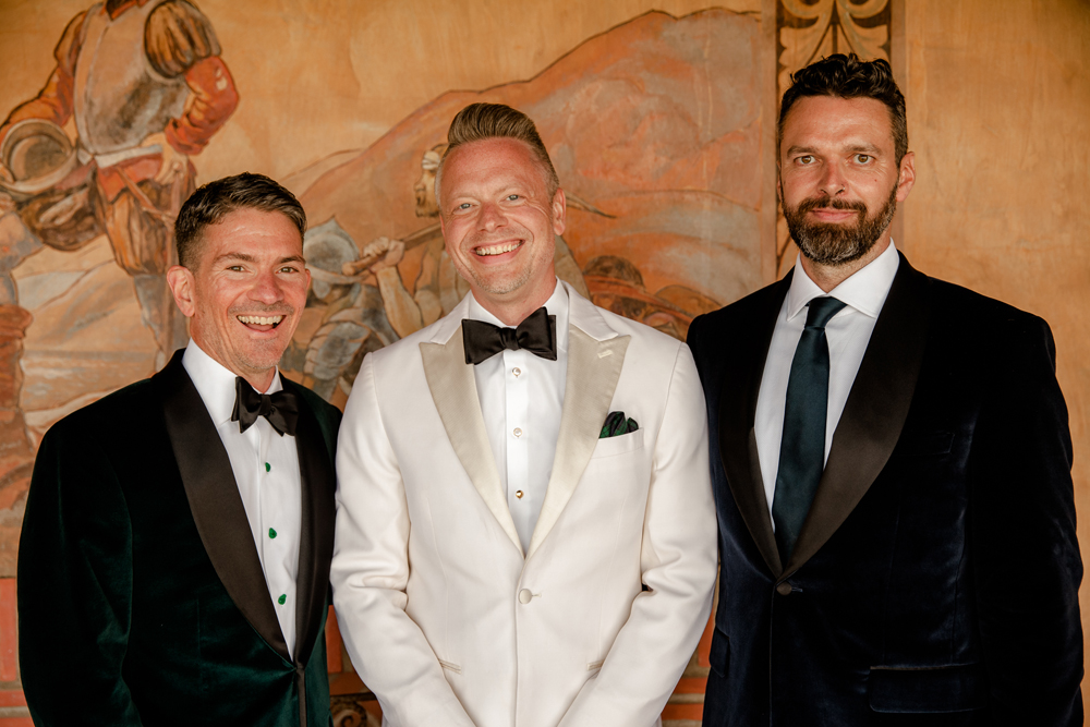 Malibu Gay Wedding Grooms Dressed in Black Tie Velvet Tuxedos and Officiant at Adamson House