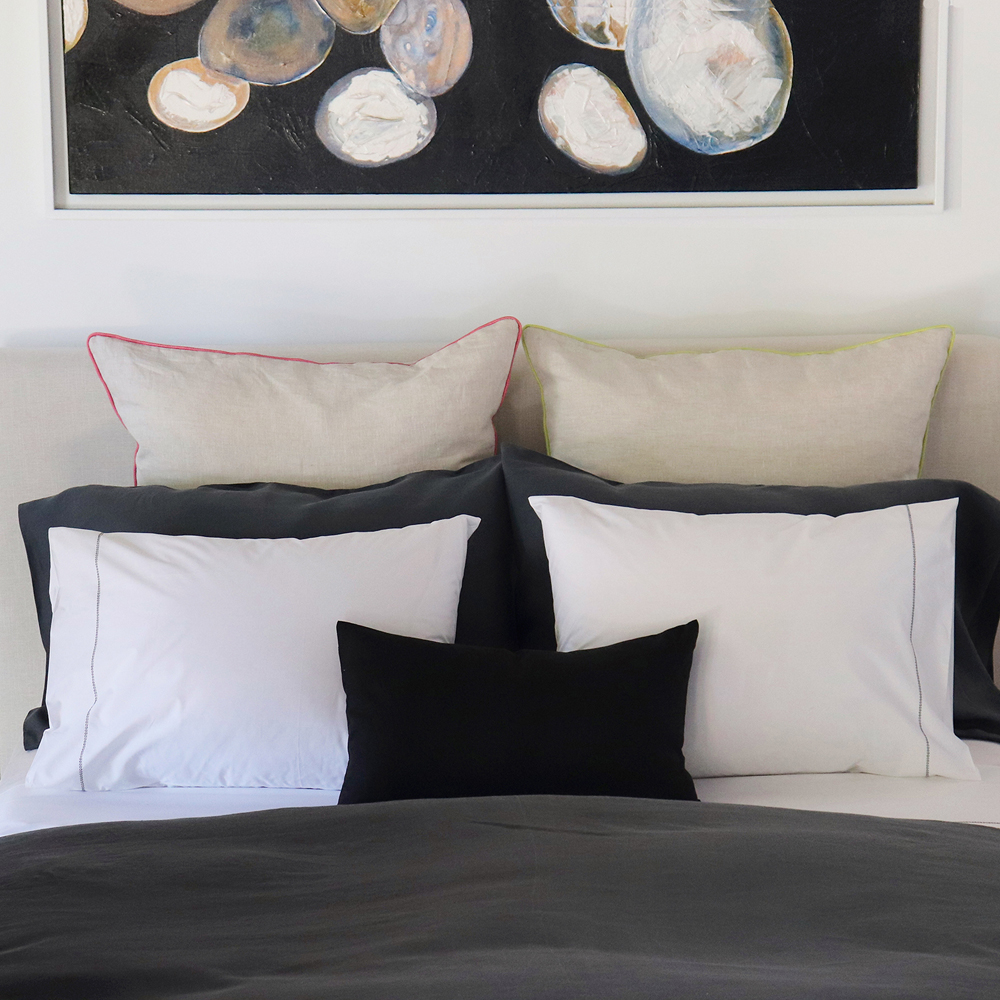 luxury cotton percale sheets with a black hemstitch paired with a slate charcoal grey Italian linen duvet cover