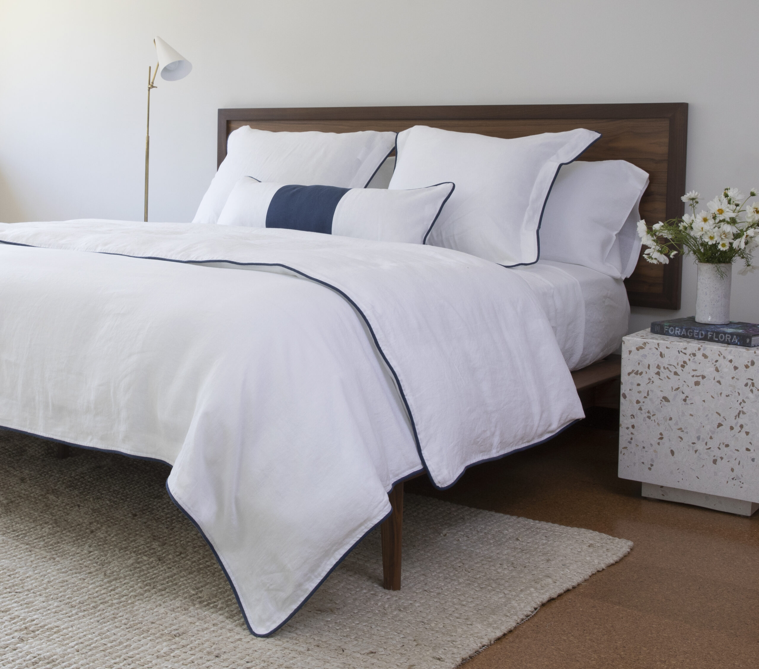 Blue and white decor: White linen duvet cover with navy blue piping edge trim 