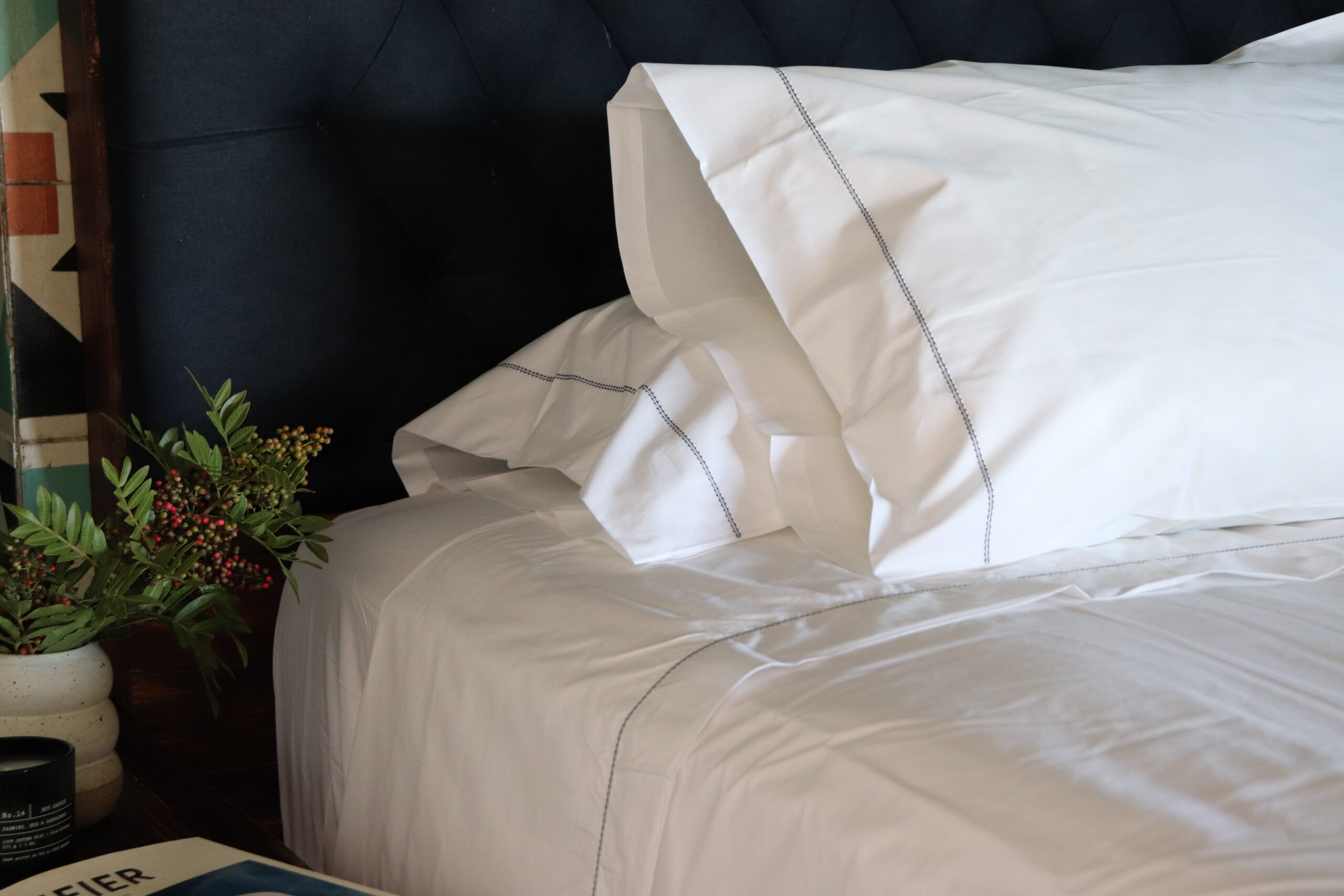 White hemstitched percale sheet set with navy blue trim